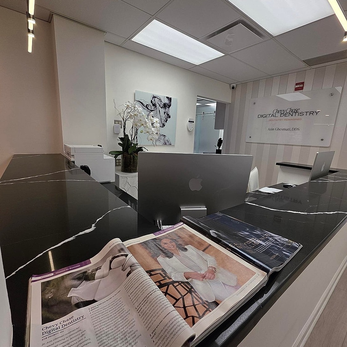 Modern dental office reception area with magazine.
