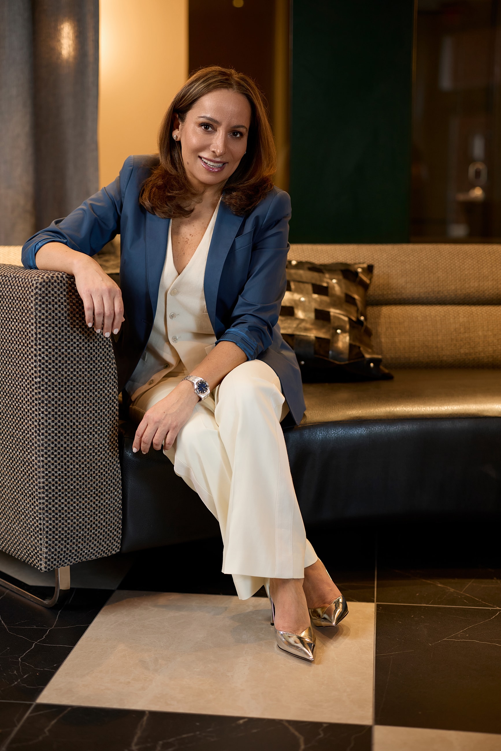 Professional woman in a stylish blazer portrait.